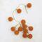 Hello Honey® 6ft. Butterscotch Flocked Glass Ball Ornament Garland with Gold Cord